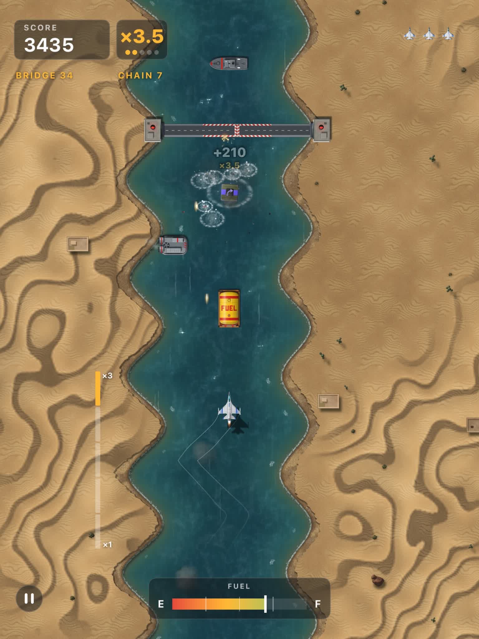 On iPad: a hit under a drawbridge in the desert, with a hovercraft on the water and dunes on both banks.