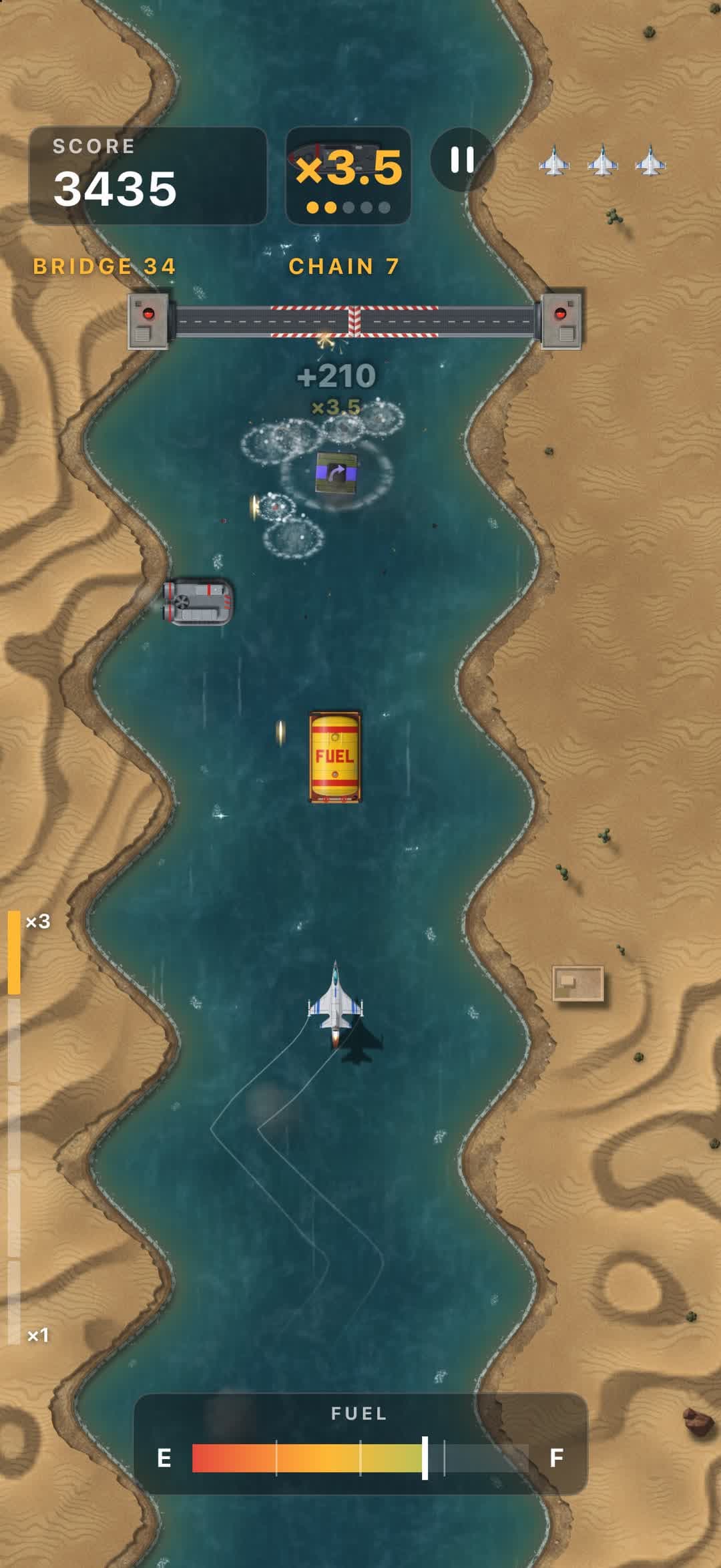 A hit under a drawbridge in the desert, with a hovercraft on the water and dunes on both banks.