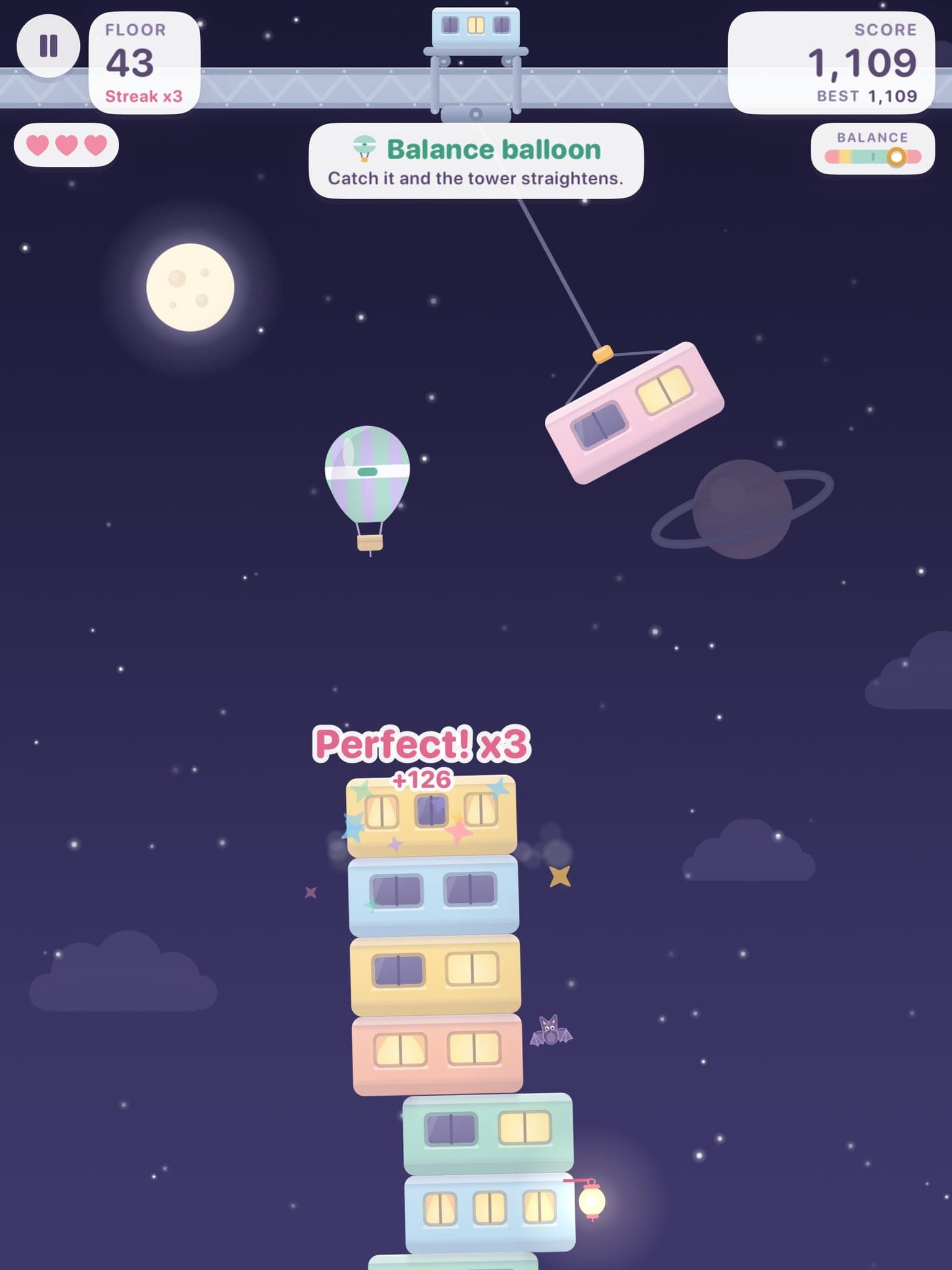 On iPad: floor 43 in space, with the hot-air balance balloon beside the tower and a Perfect streak of three.
